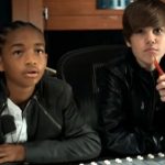 This is the image of Justin bieber sitting with a boy from the song Never say never