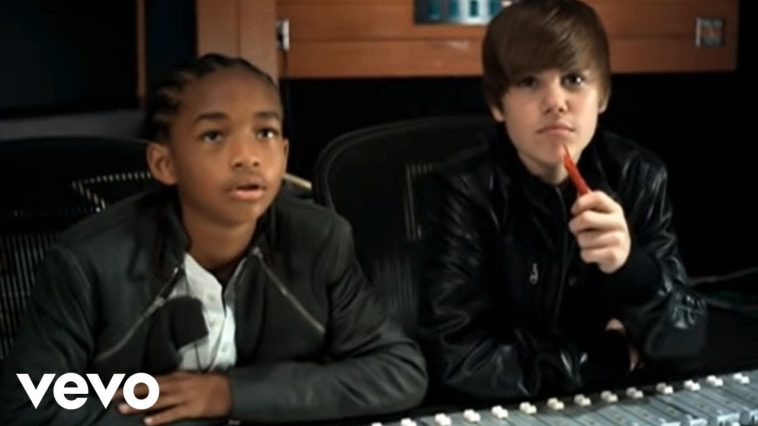 This is the image of Justin bieber sitting with a boy from the song Never say never