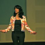 Image of RJ Malavika Varadan presenting TED talk at BITS Pilani