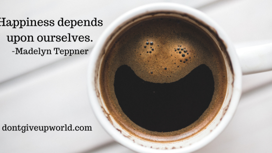 It is the image of cup and smile face is made inside it, and Quote on Happiness by Madelyn Teppner is written