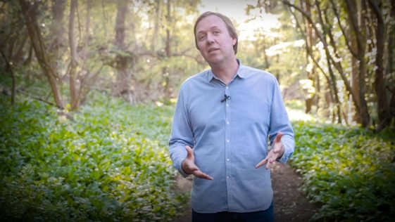 This image containg the photo of Ted speaker Rivett carnac wearing blue shirt