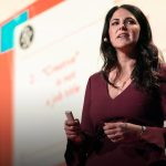 Picture of Lauren Braitman giving speech. Click on the picture to watch TED talk on mental helath Benefits for Heath care workers by Lauren Braitman